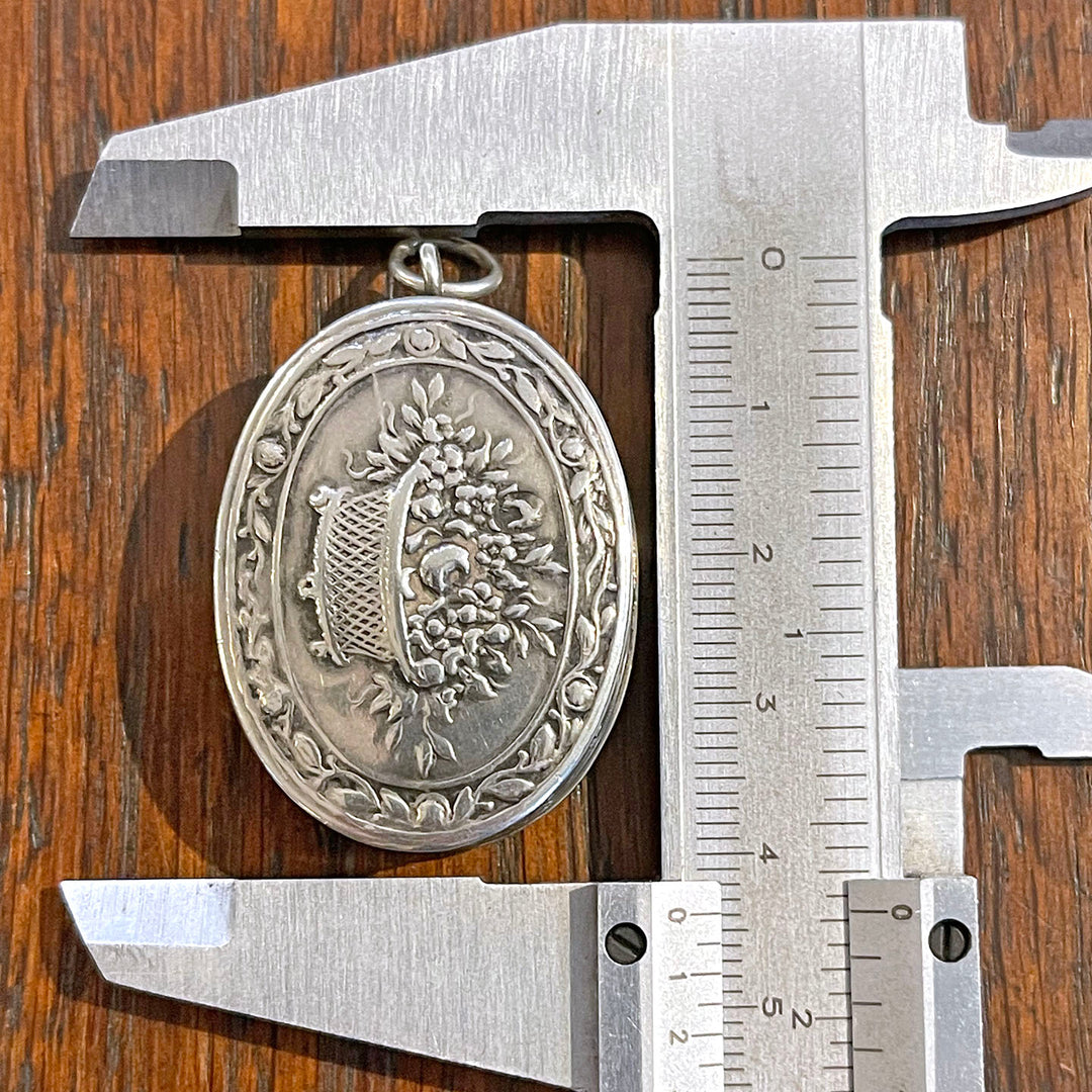 Antique Silver Repoussé Pill Box Pendant with Basket of Flowers, c. 1890