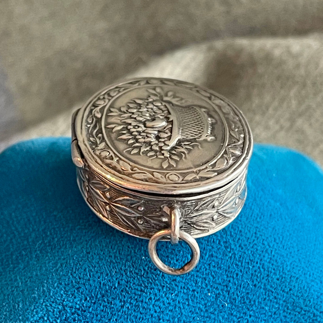 Antique Silver Repoussé Pill Box Pendant with Basket of Flowers, c. 1890