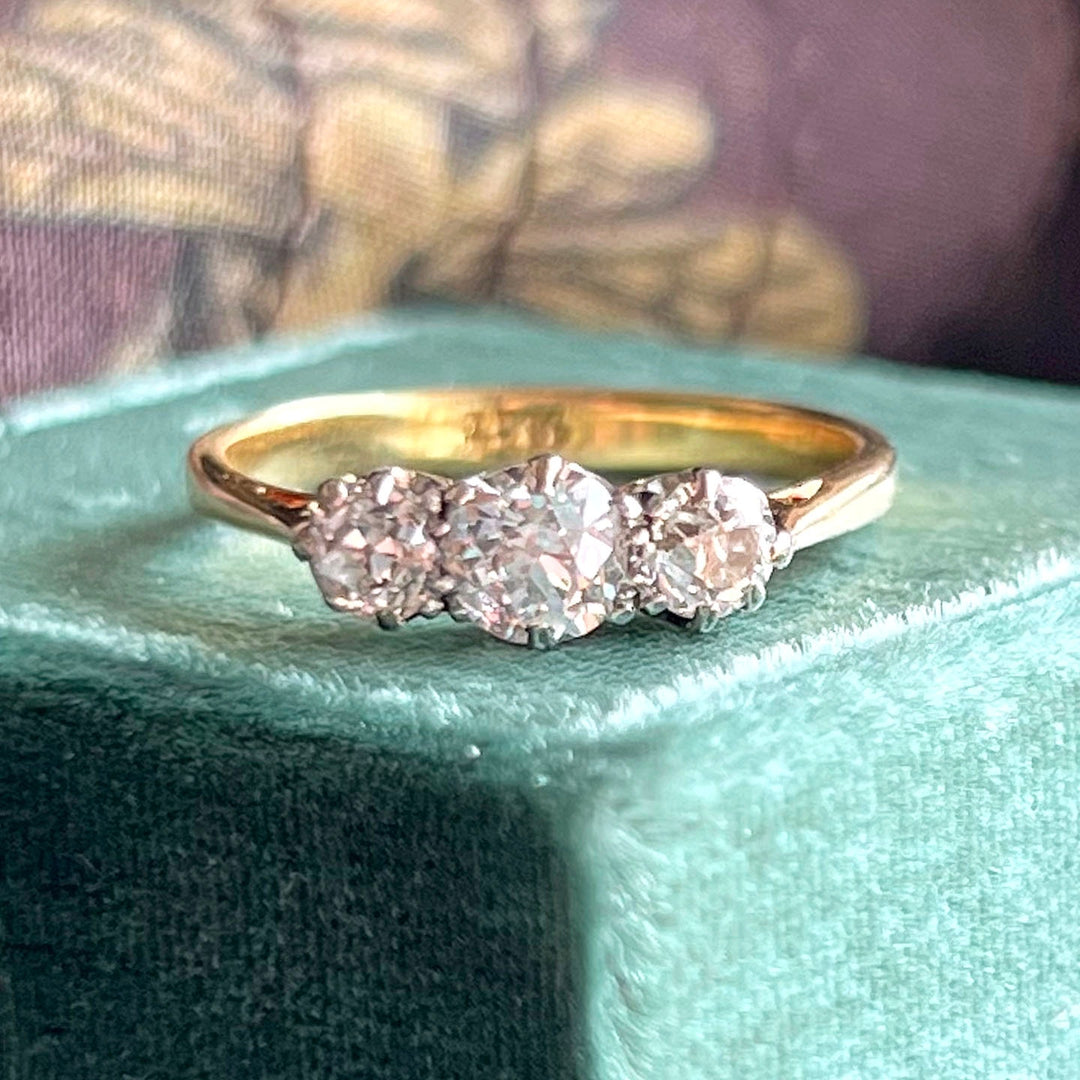 Antique Art Deco 18K gold and platinum three stone diamond ring circa 1920