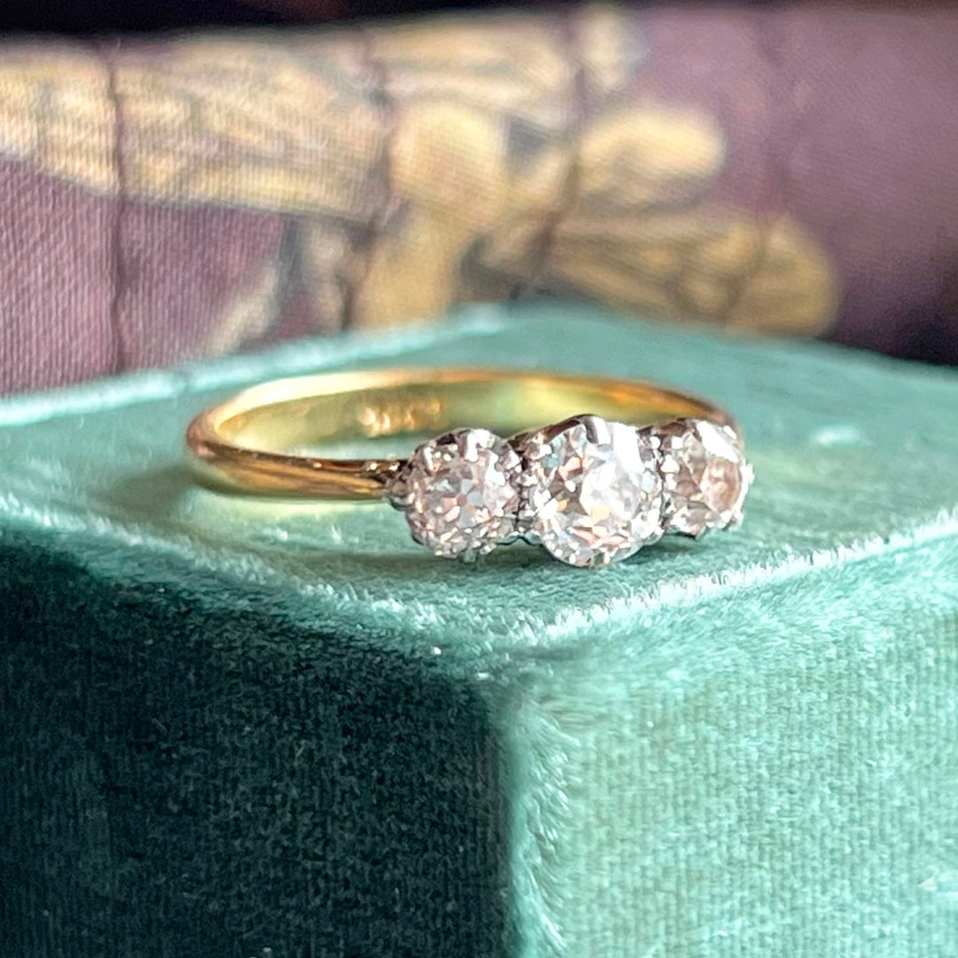 Close up Art Deco three stone diamond settings