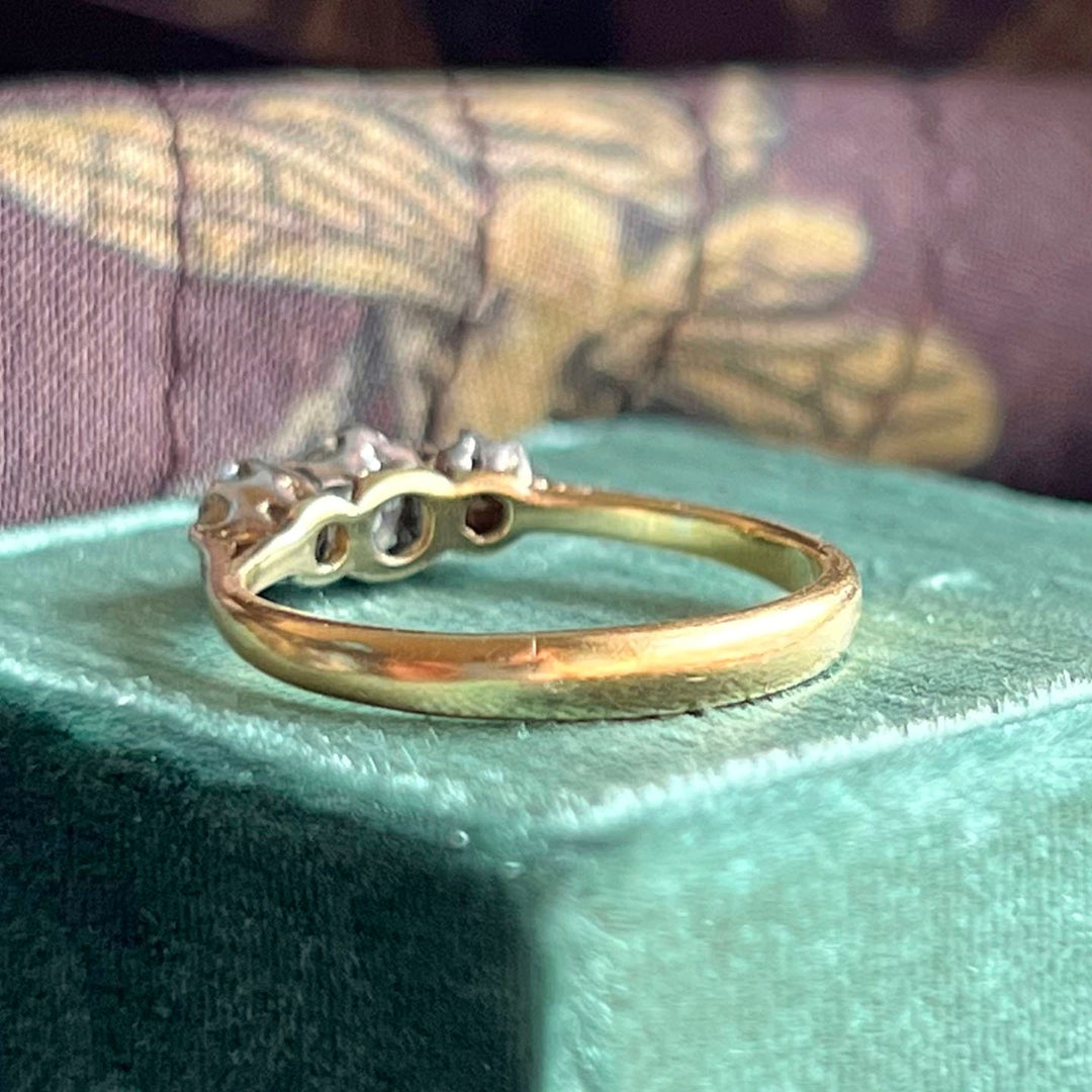 Estate three stone diamond ring detail