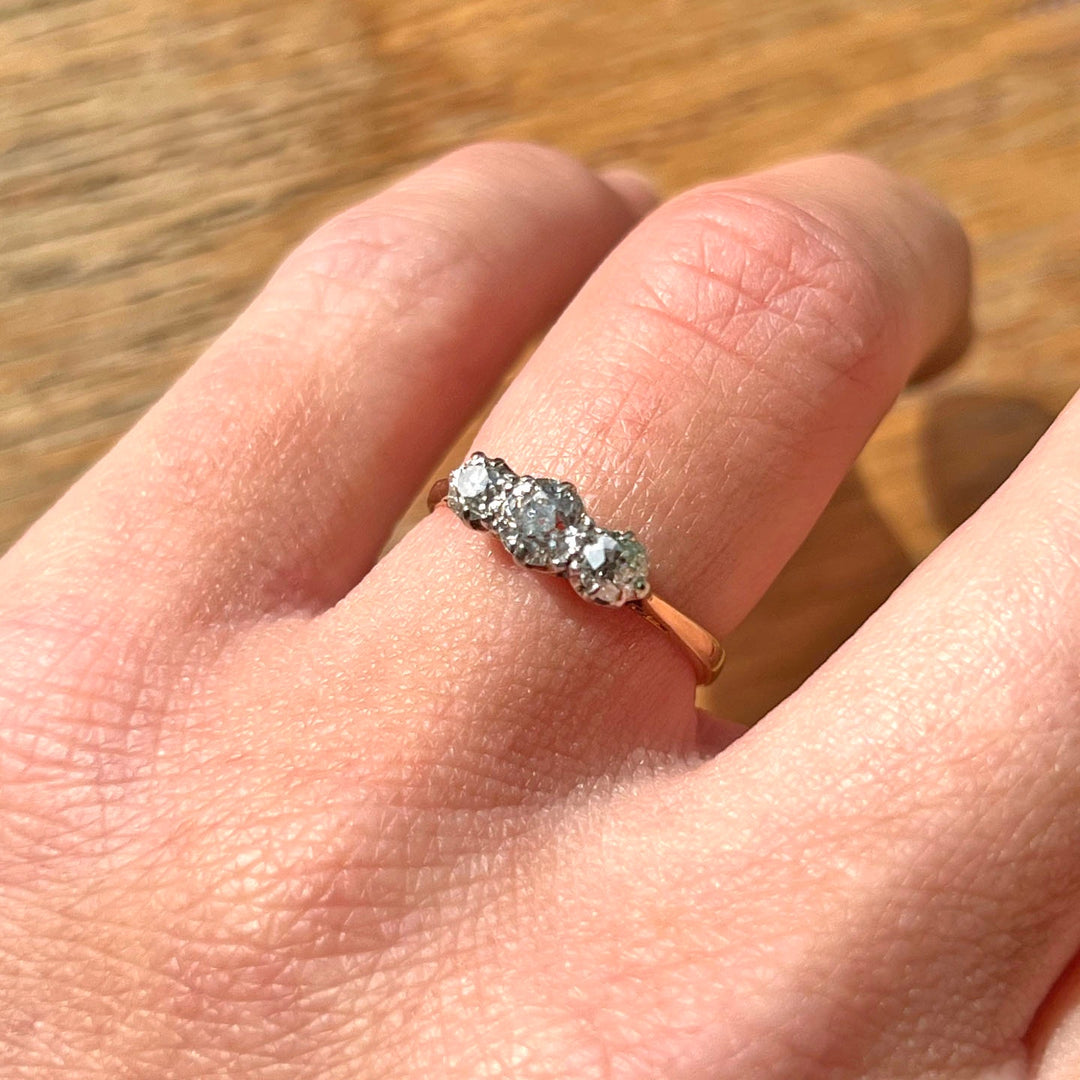 Antique gold platinum diamond engagement ring on hand
