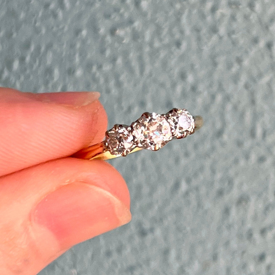 Close up Art Deco three stone diamond settings