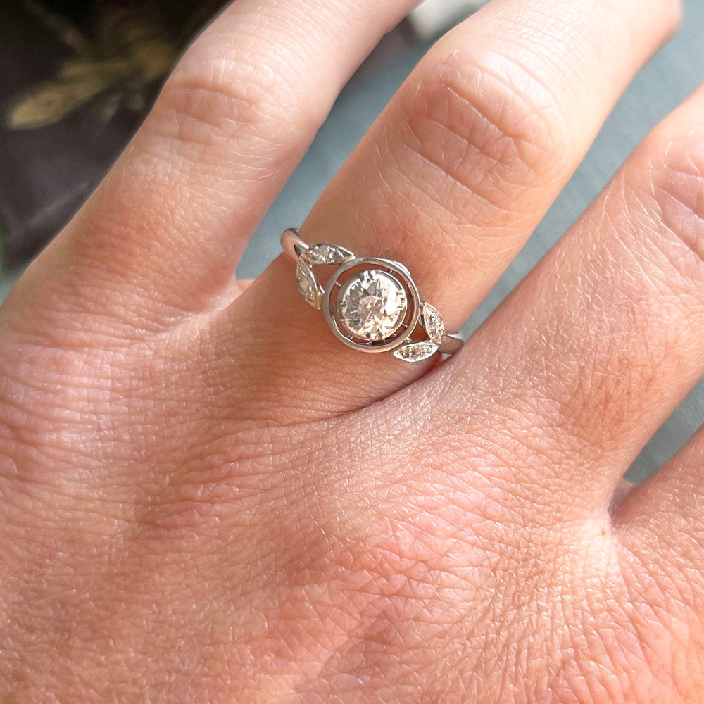 Antique French gold diamond solitaire ring on hand