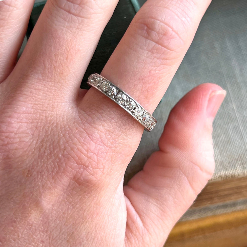 Antique diamond eternity band from the 1920s on hand
