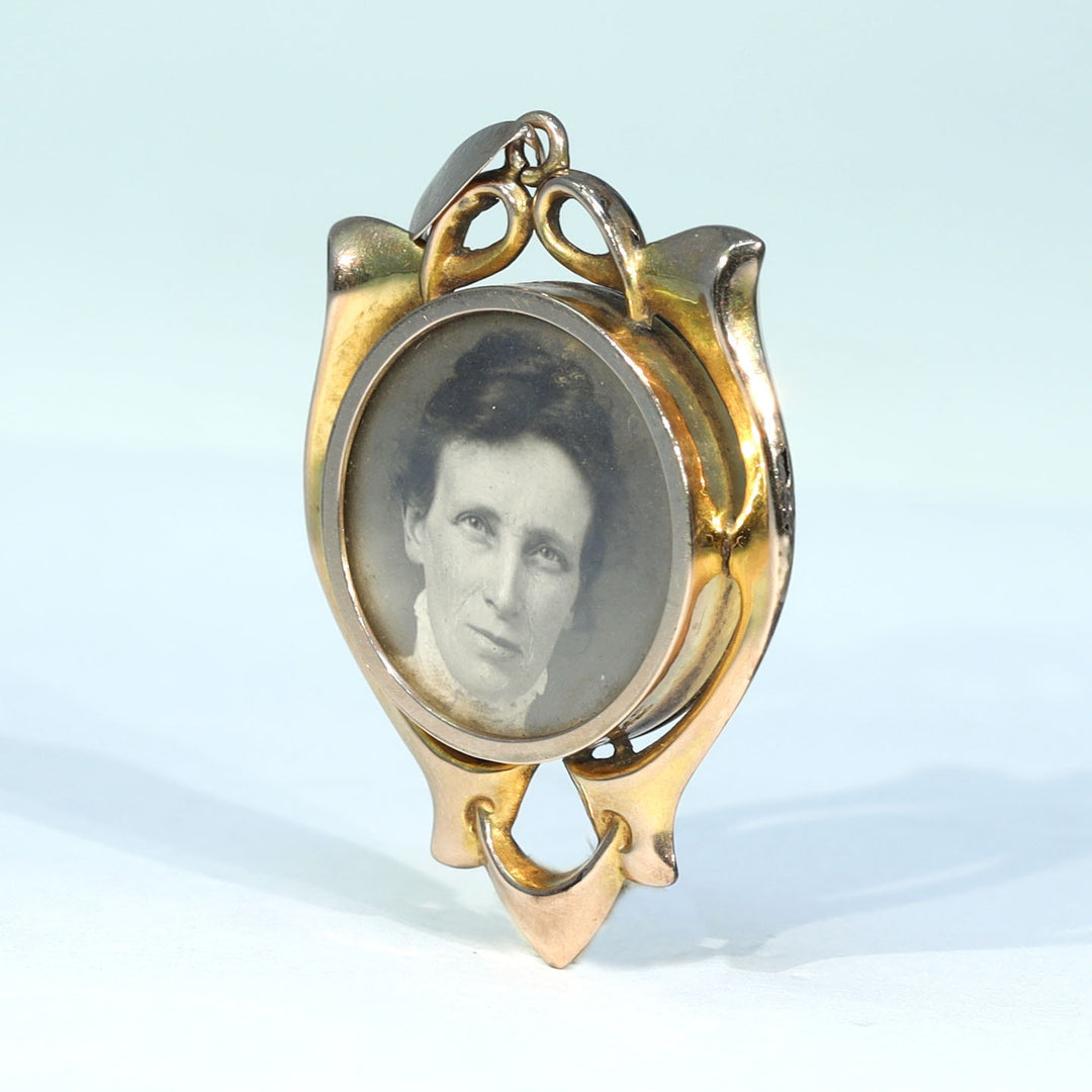 Edwardian era gold locket with two original photographs