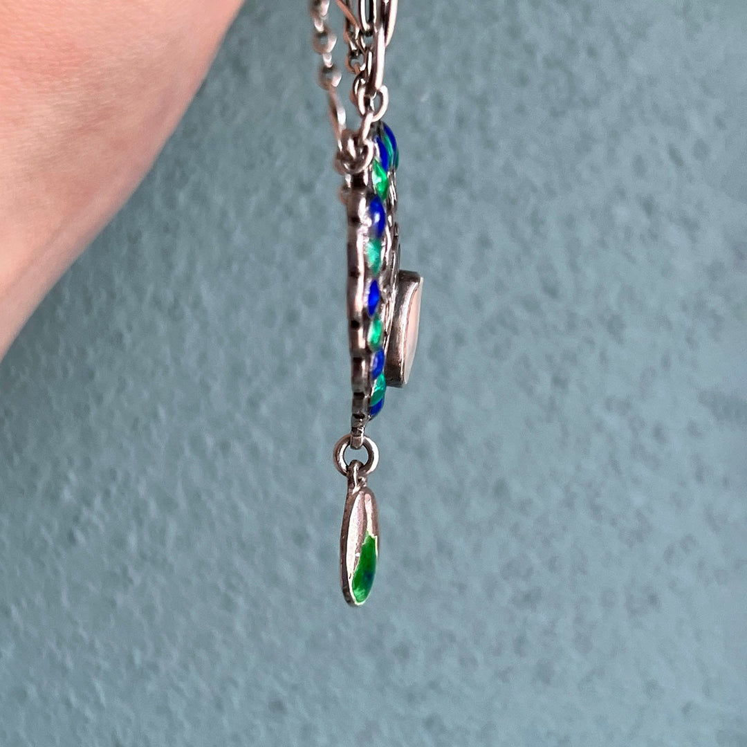 Side profile of silver pendant necklace