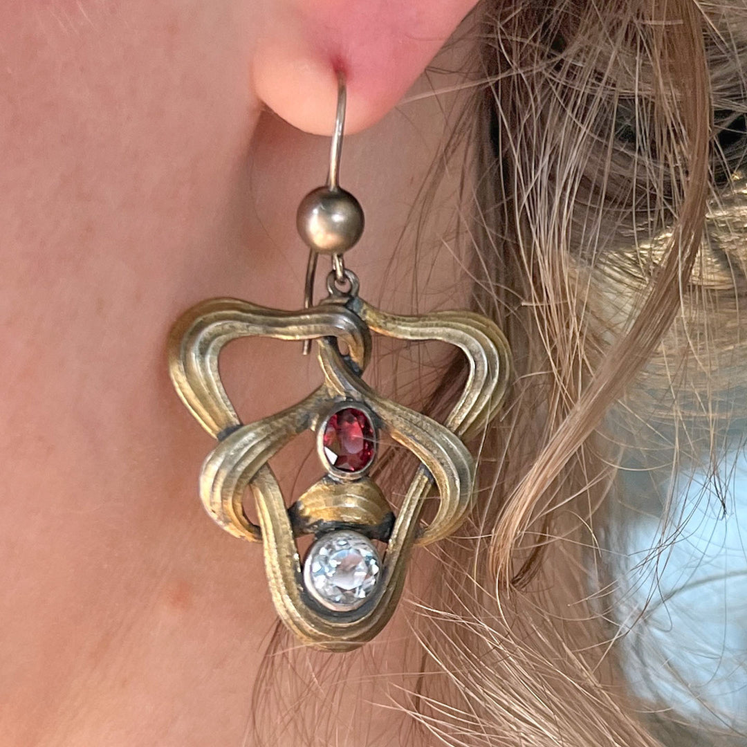 Art Nouveau earrings worn on ear antique style