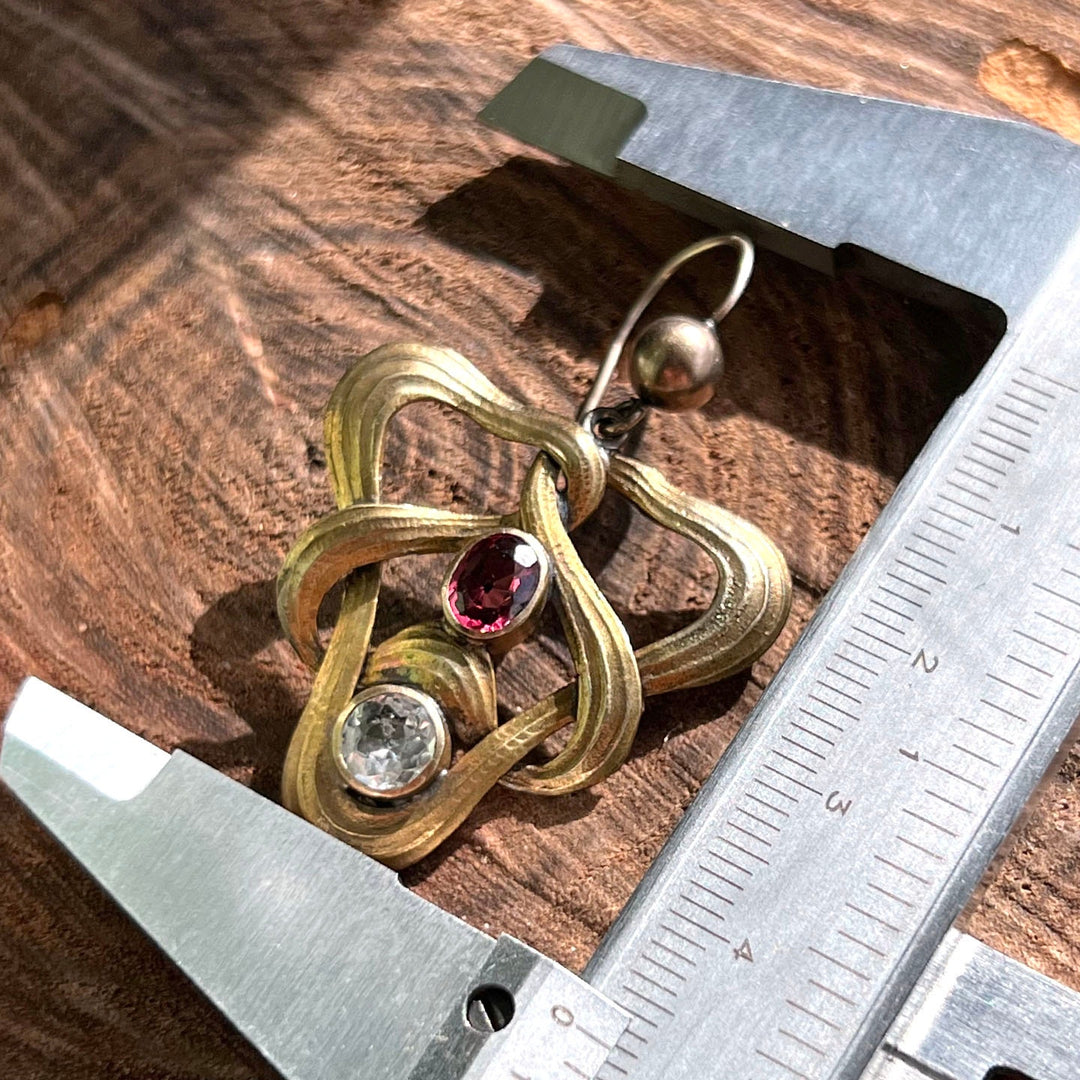 Art Nouveau earrings worn on ear antique style