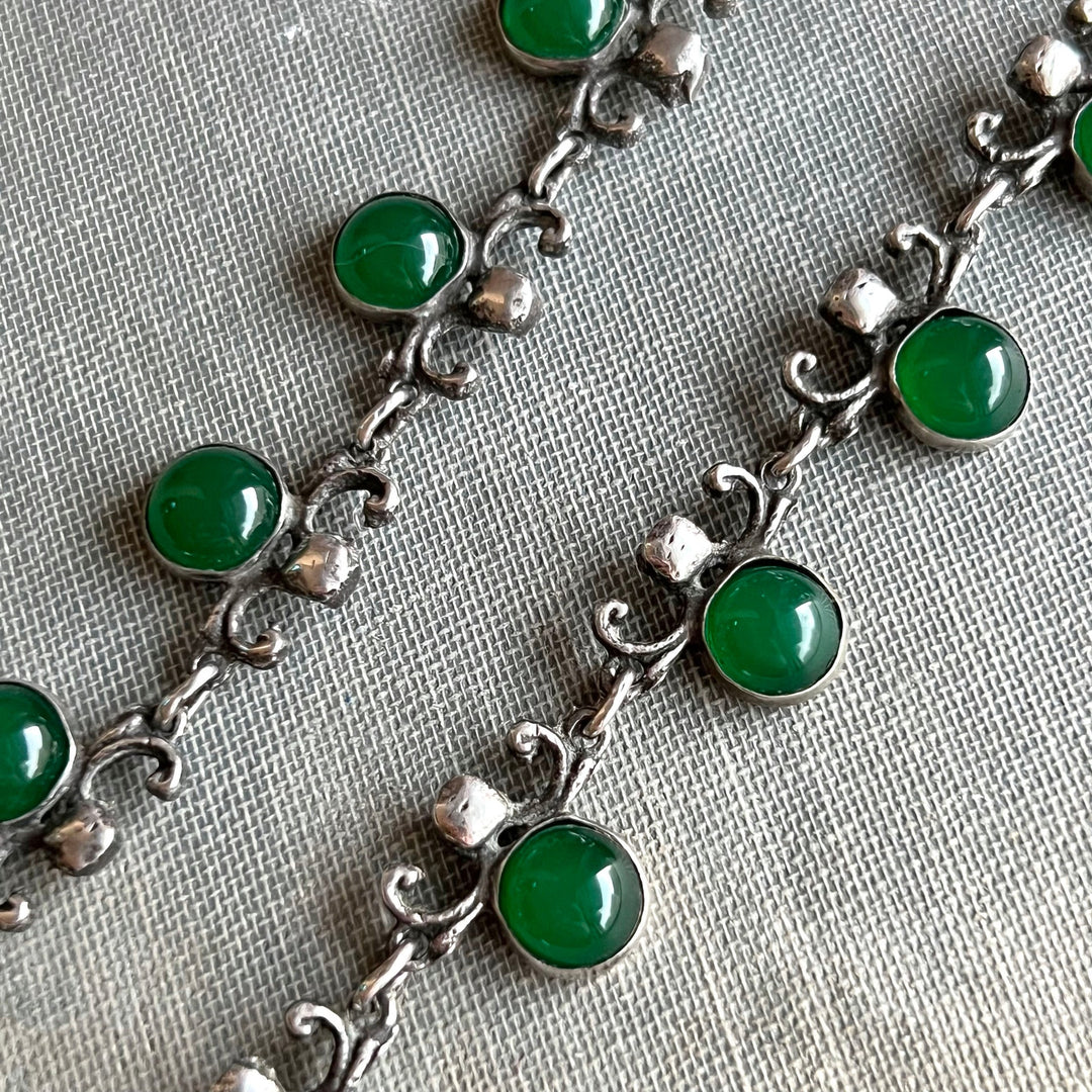Close view of green glass drop necklace