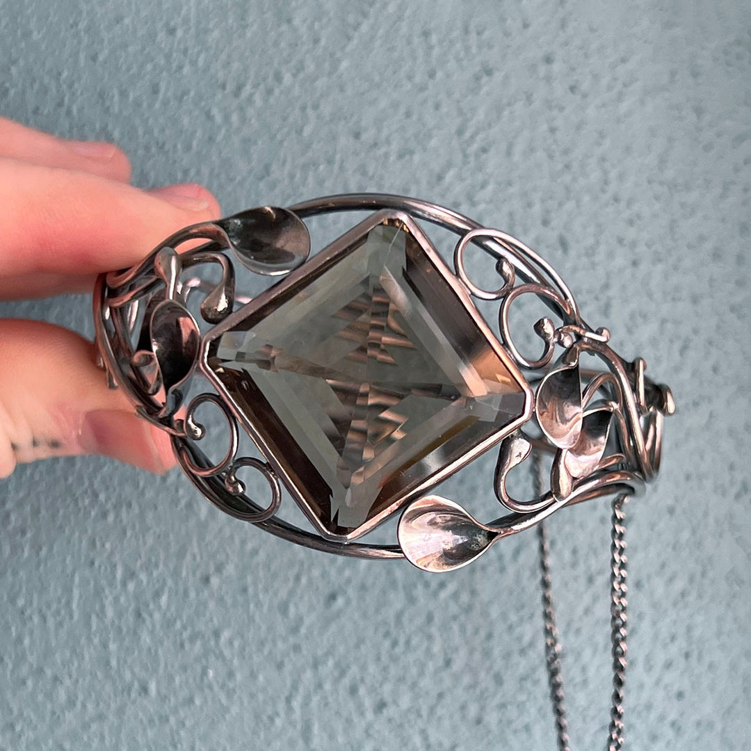 Antique silver bangle with luminous quartz