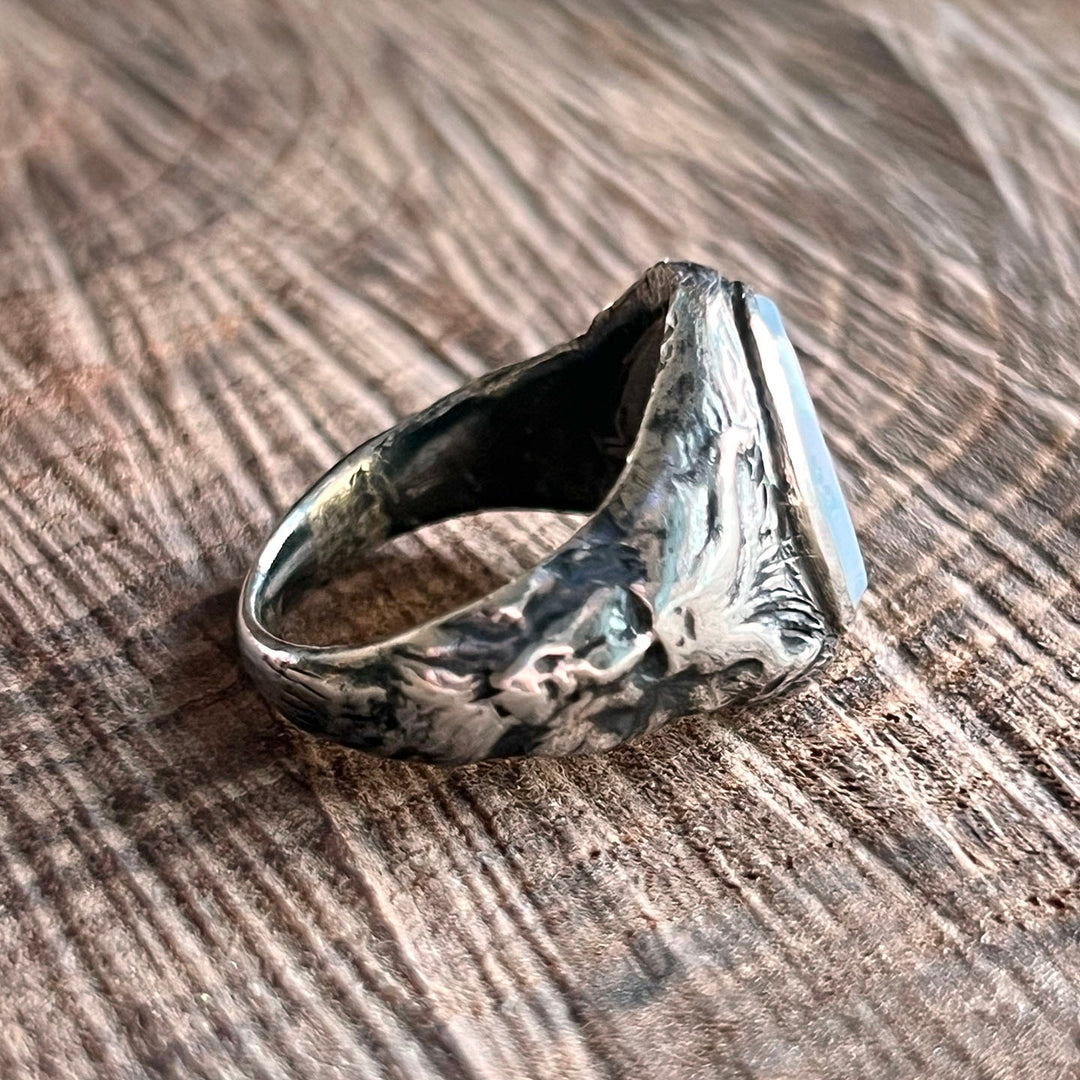 Antique figural ring with glowing chalcedony