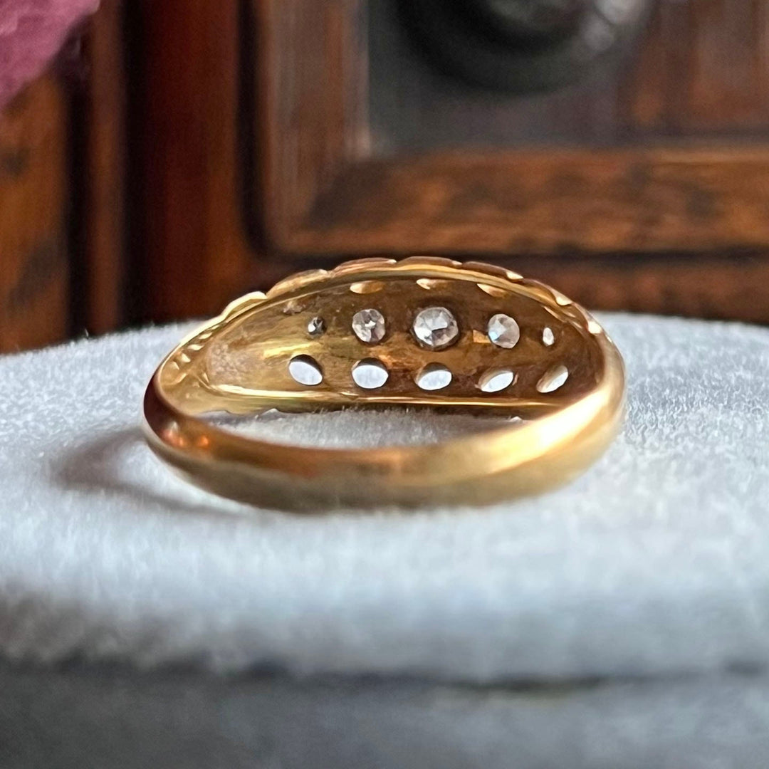 Close up old cut diamonds in antique five stone boat ring