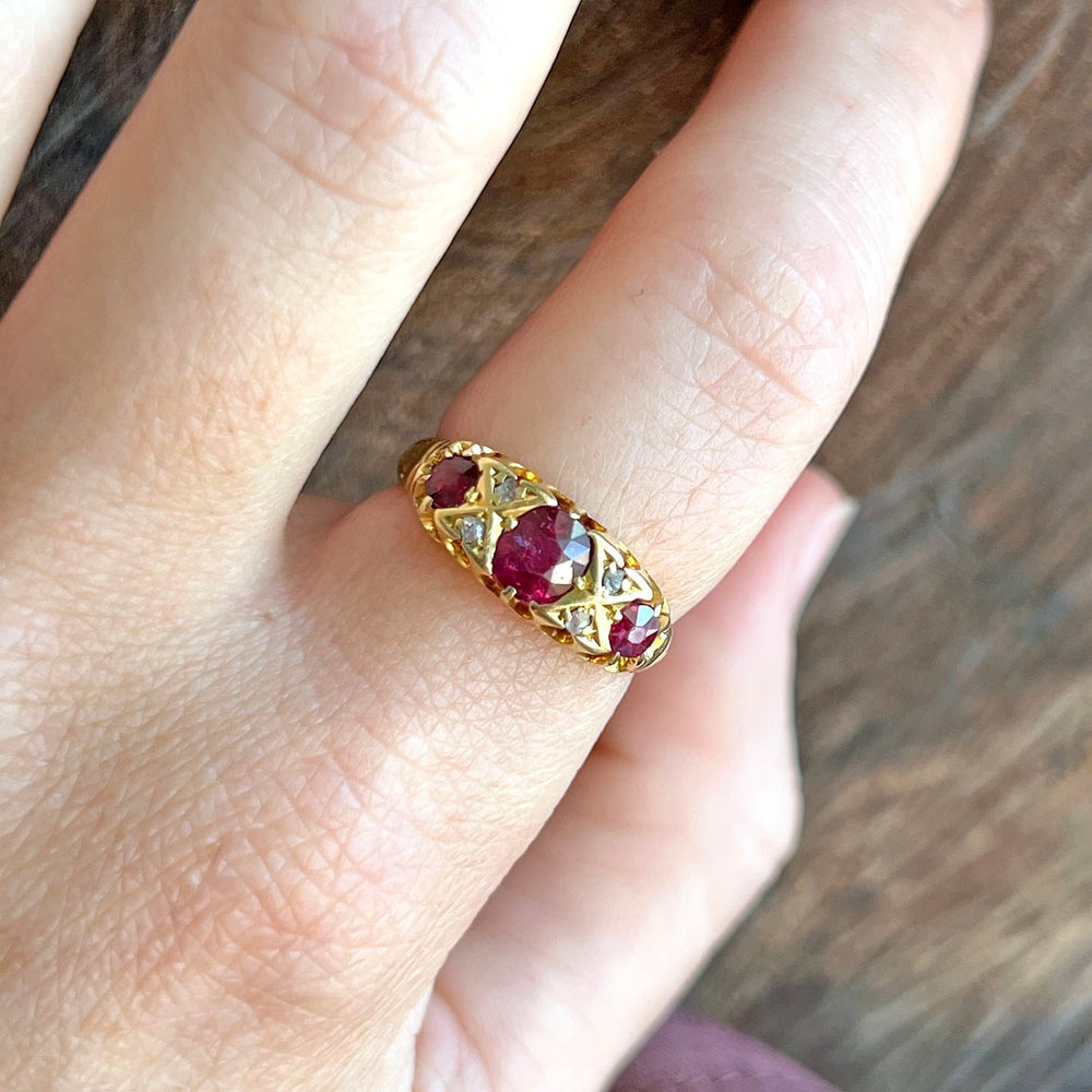 Antique ruby and diamond ring on hand