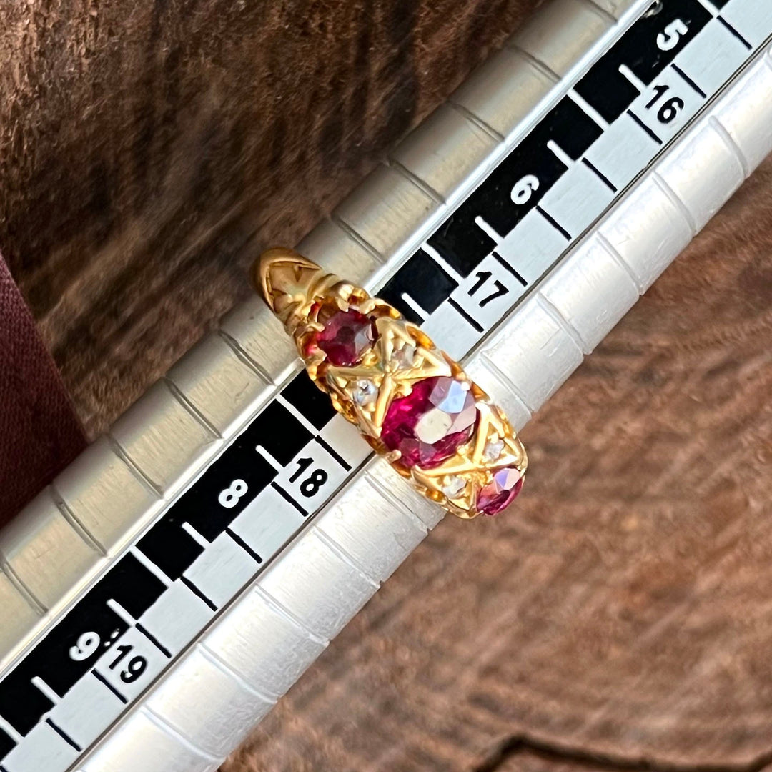 Estate seven stone ruby and diamond ring detail