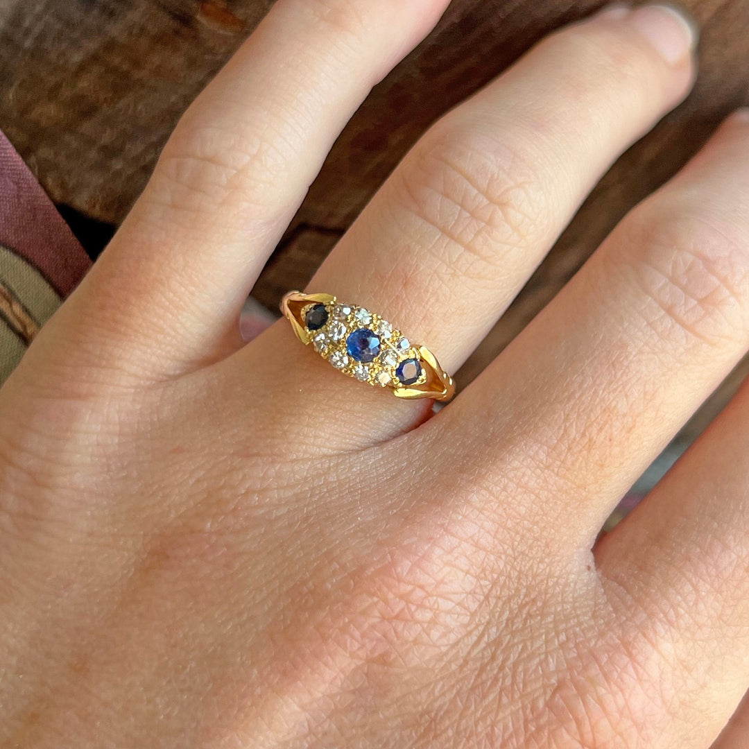 Antique sapphire and diamond ring on hand