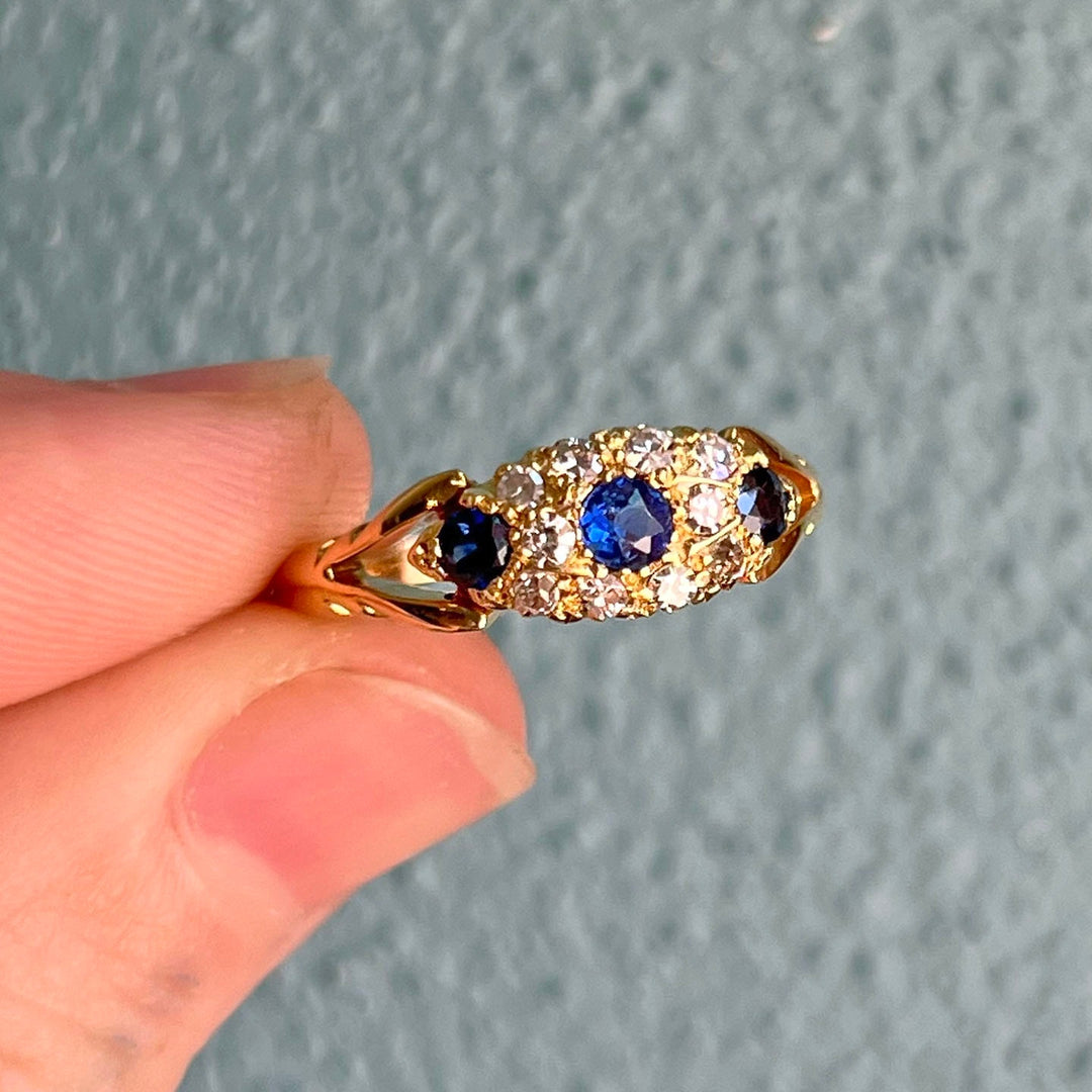 Vintage sapphire and diamond boat ring close up