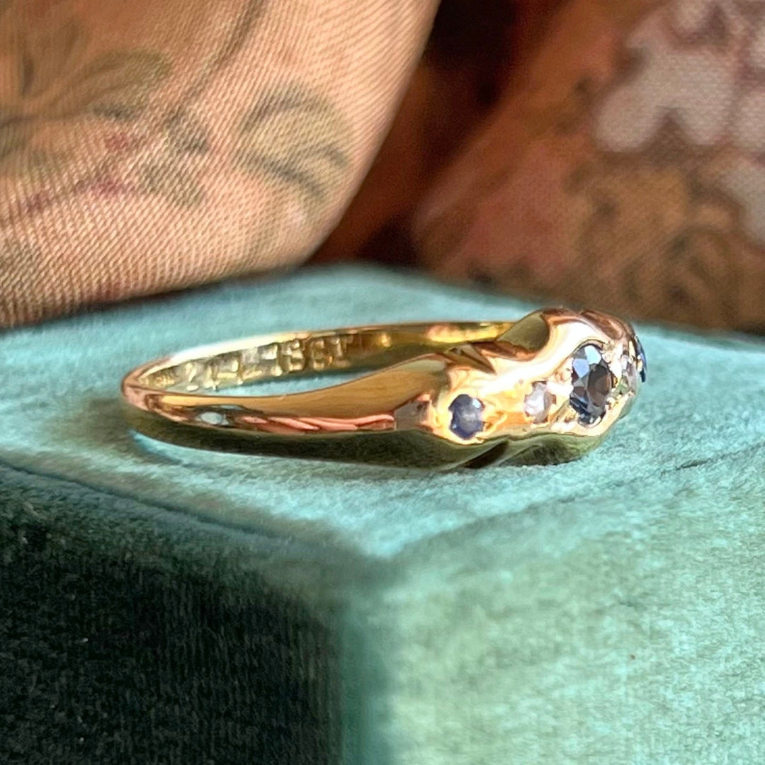 Edwardian sapphire diamond five stone ring angled view 18k gold