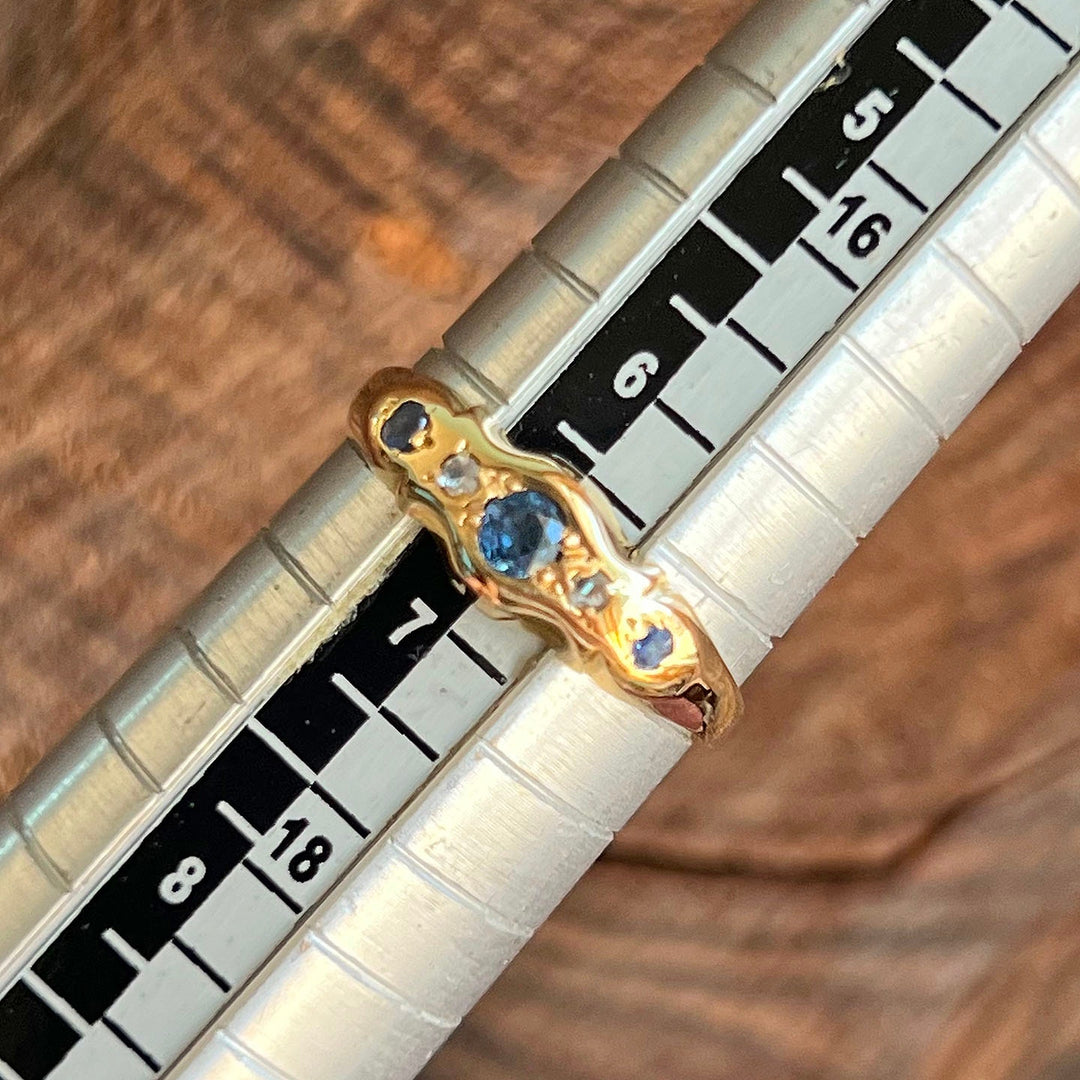 Close up sapphire and old cut diamond Edwardian five stone ring