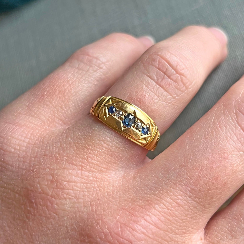 Edwardian sapphire diamond ring worn on hand antique design