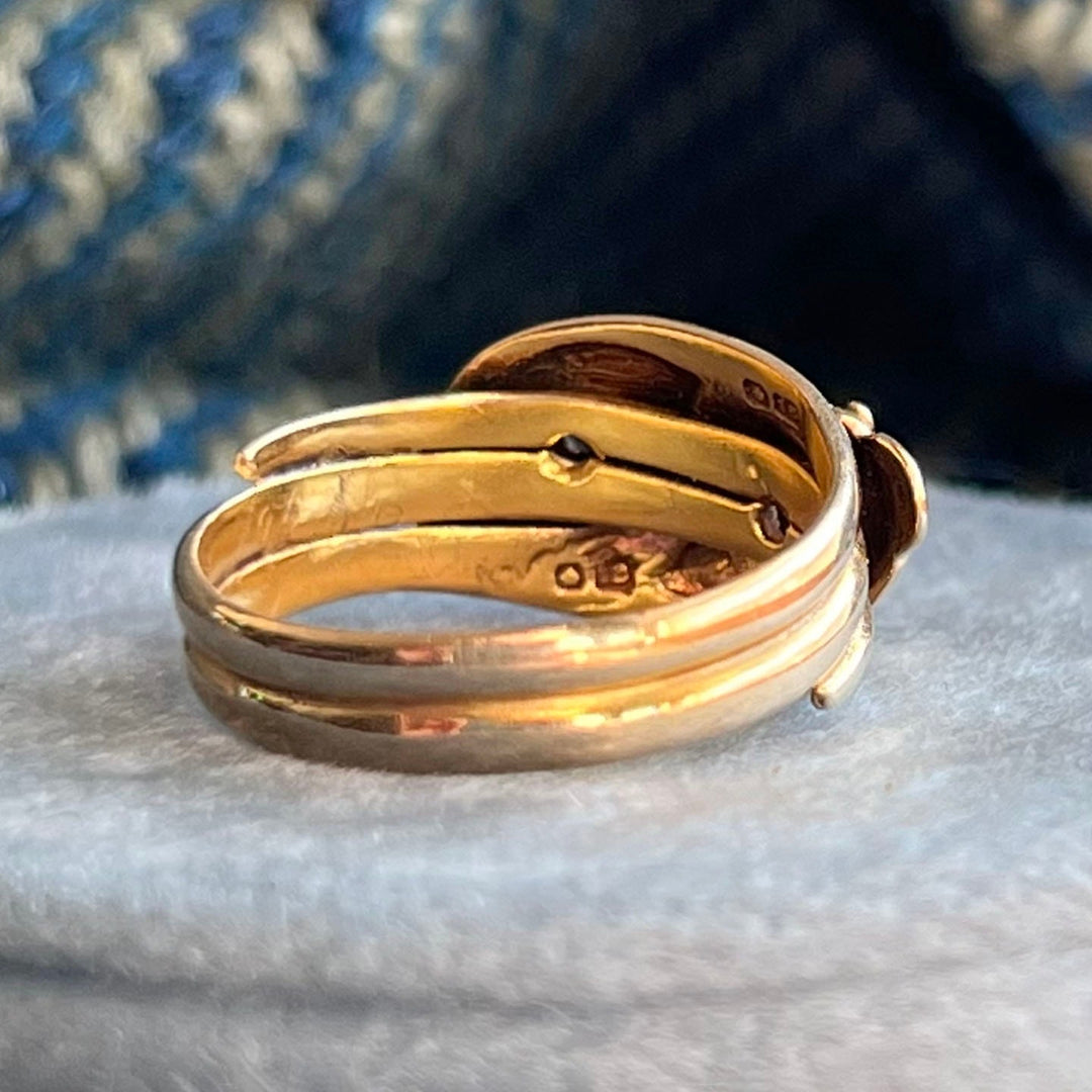 Detail of diamond set snake heads antique ring