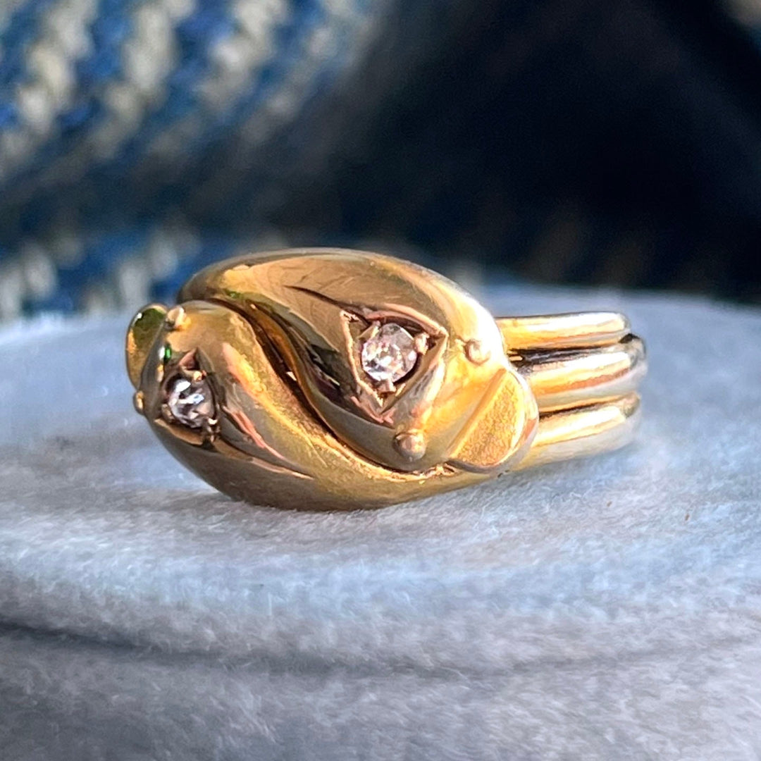 Victorian style snake ring with diamond set heads gold