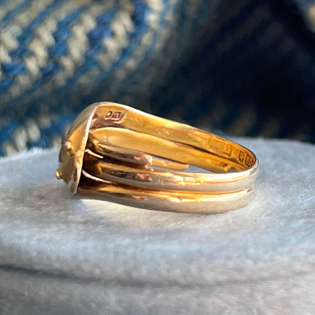 Close up antique snake ring detailed gold wrap design