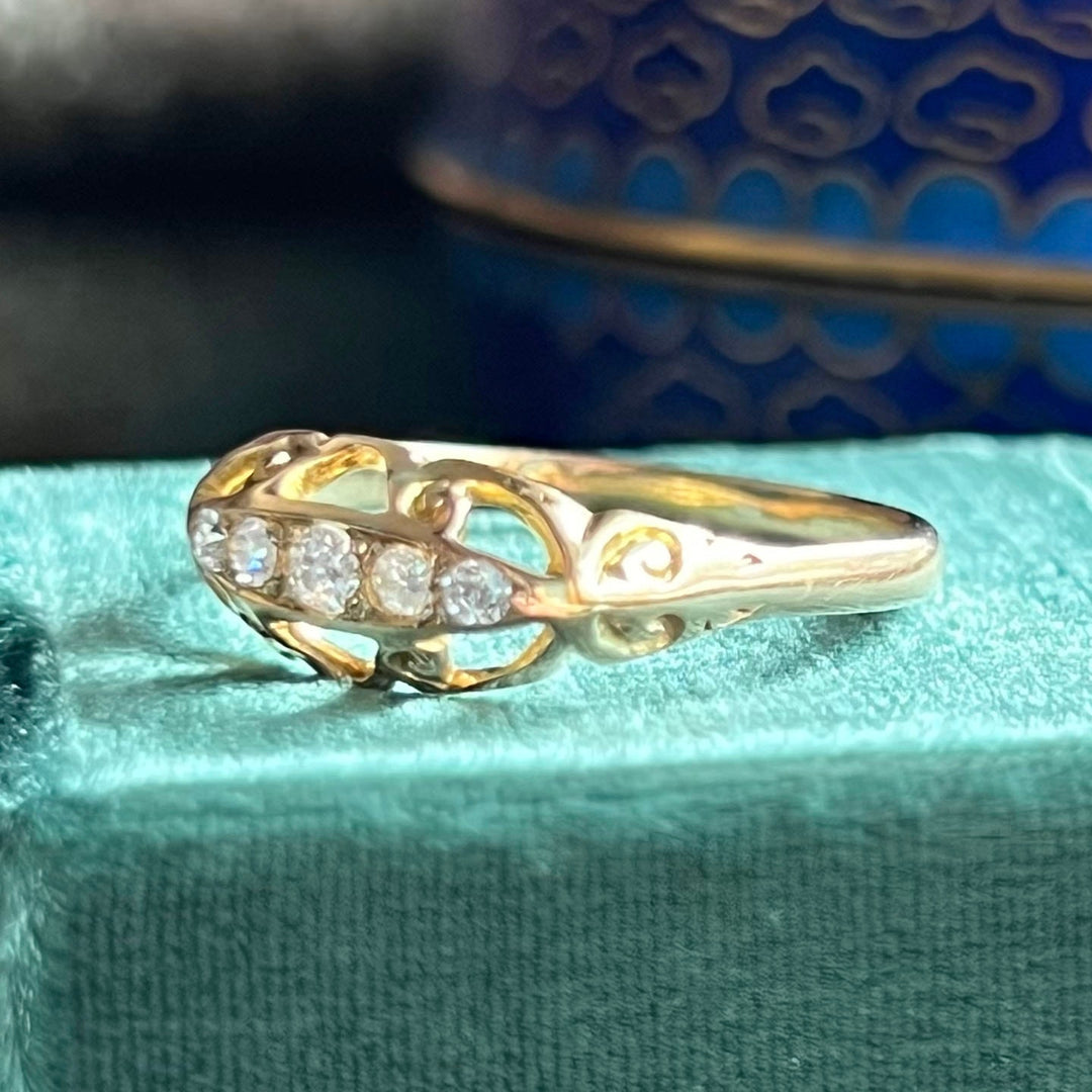 Antique five stone diamond ring showing early cut diamonds and gold band