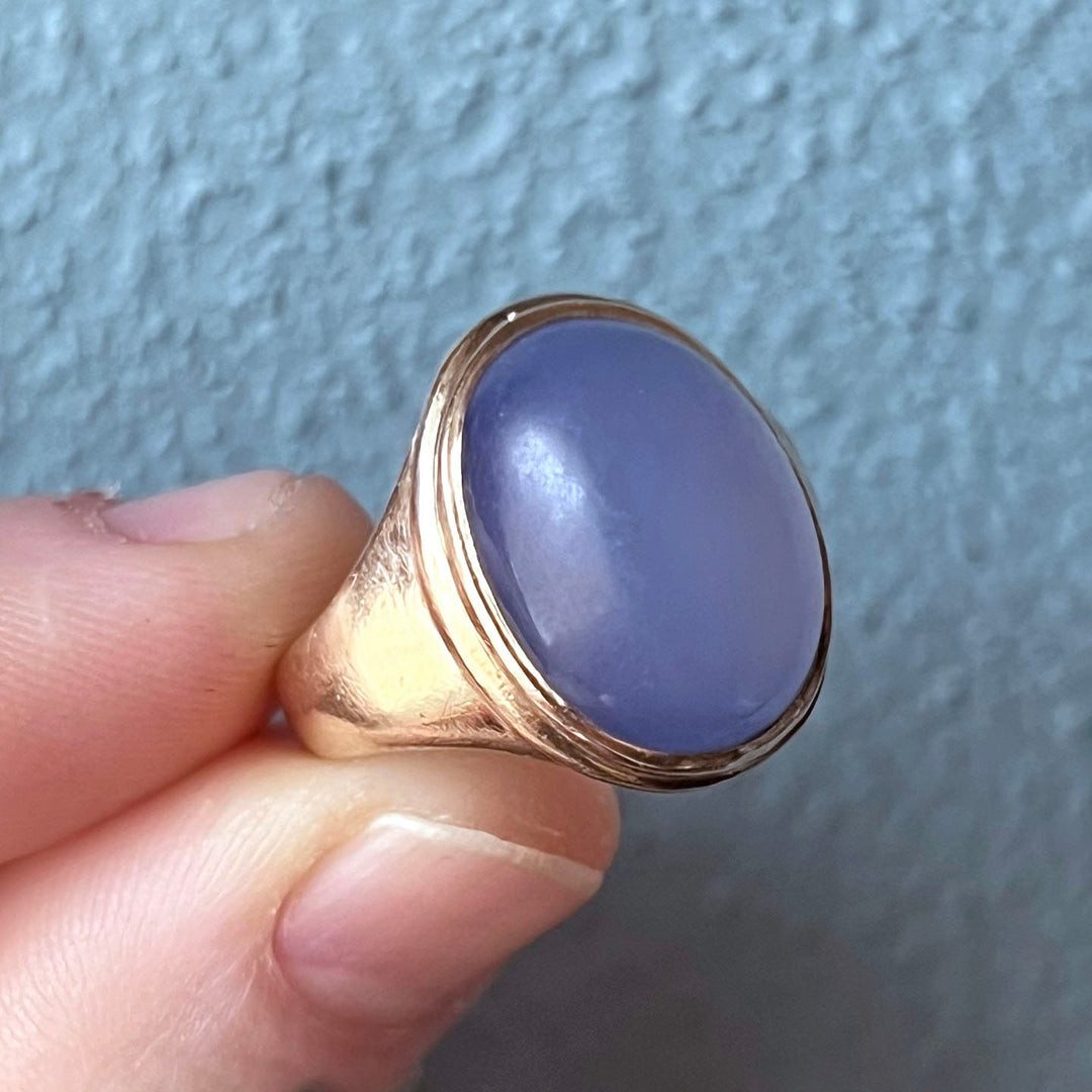 Detailed view of blue cabochon setting