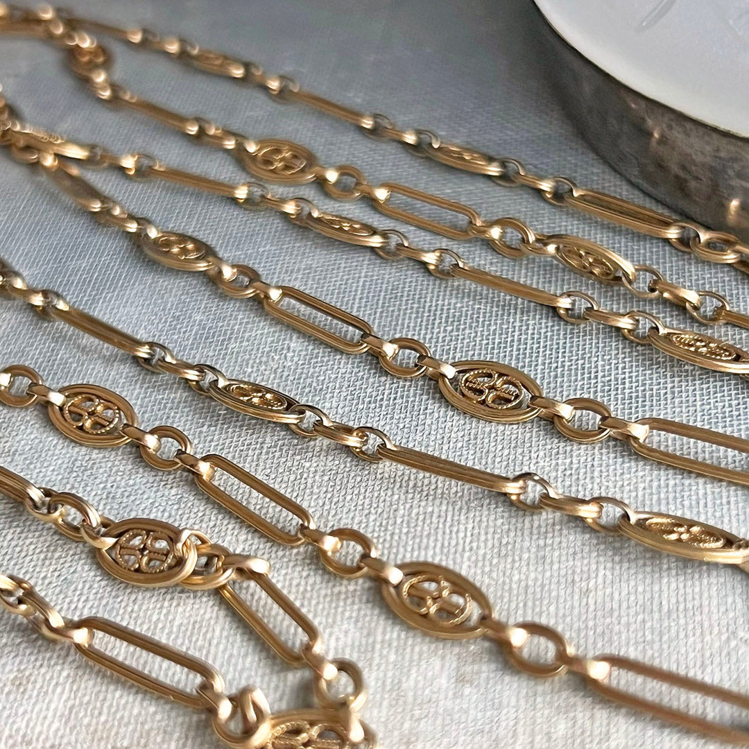 Close up antique gold elongated links chain necklace