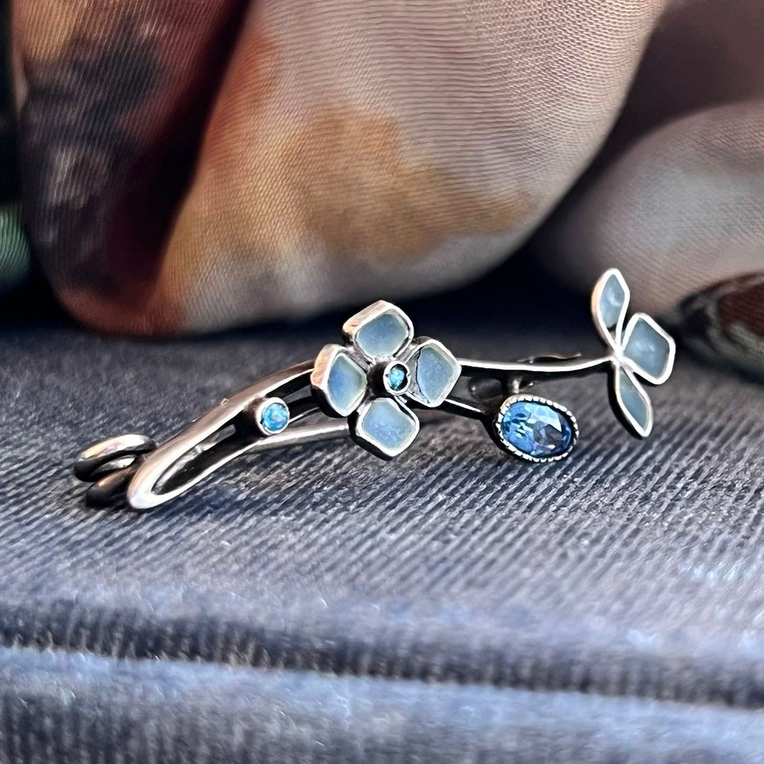 Detailed view of translucent enamel jewelry