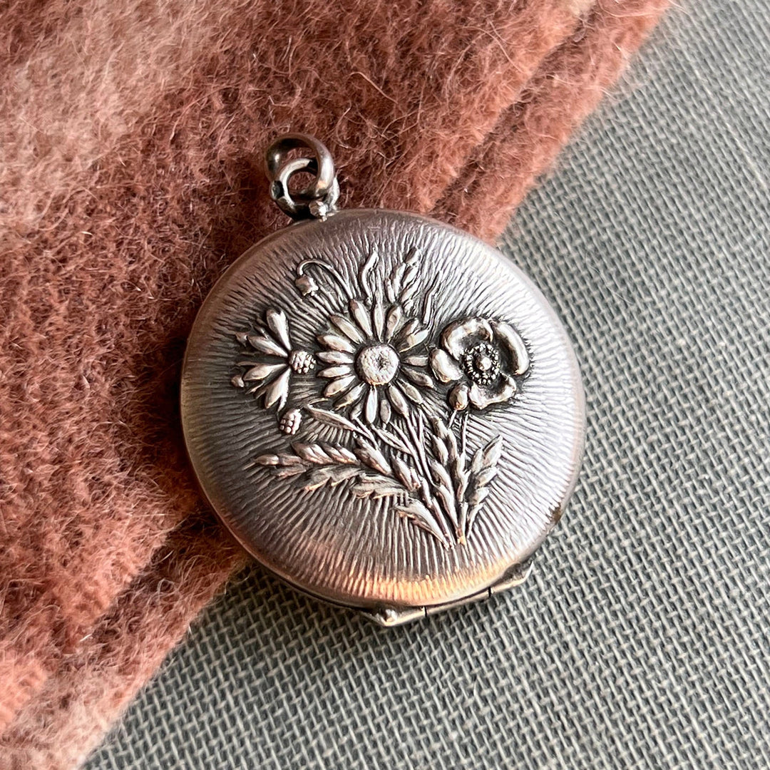 Antique French silver repoussé floral locket c1900