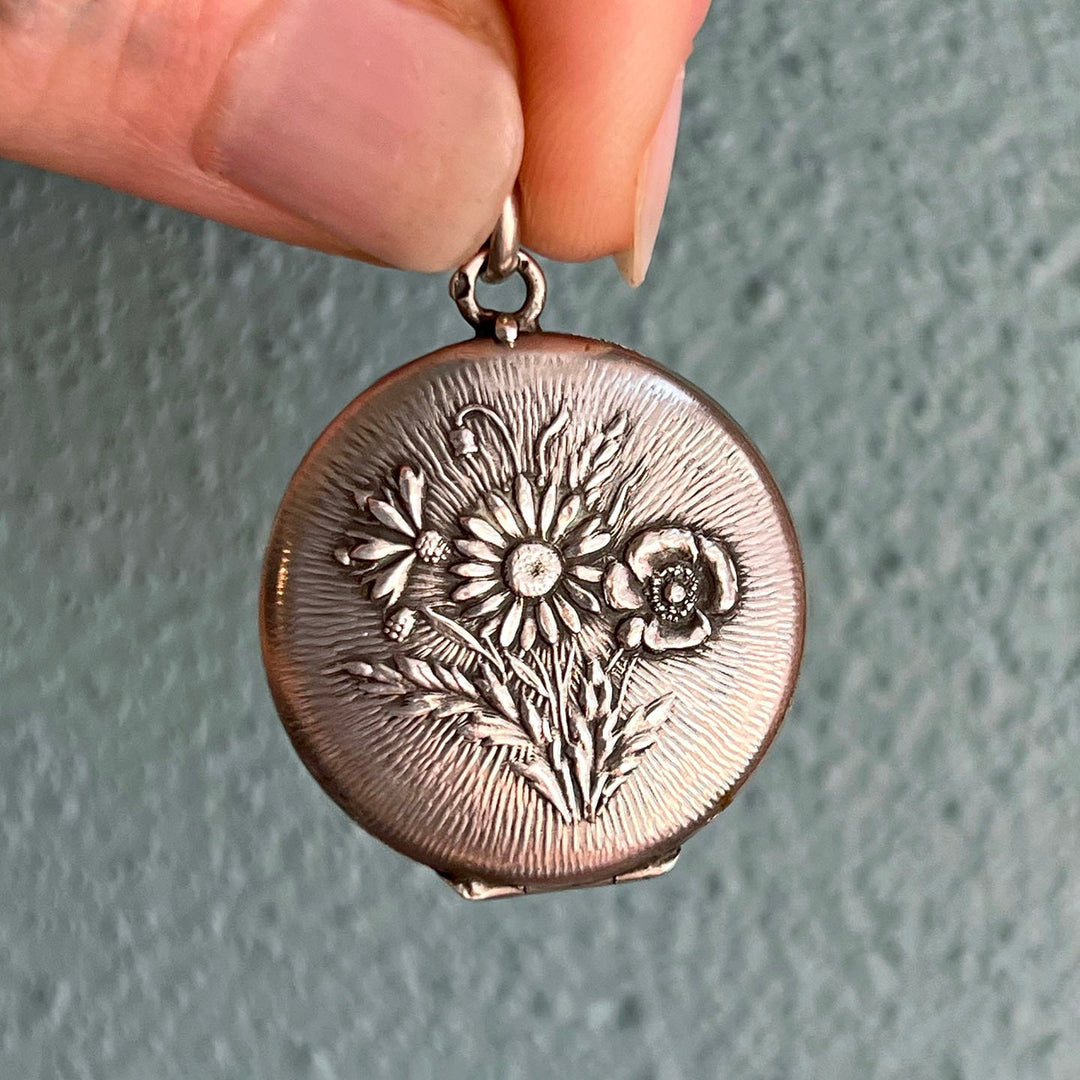 French silver floral locket raised repoussé design
