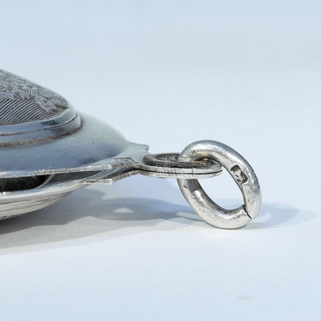 Collectible French silver slide locket with figural design