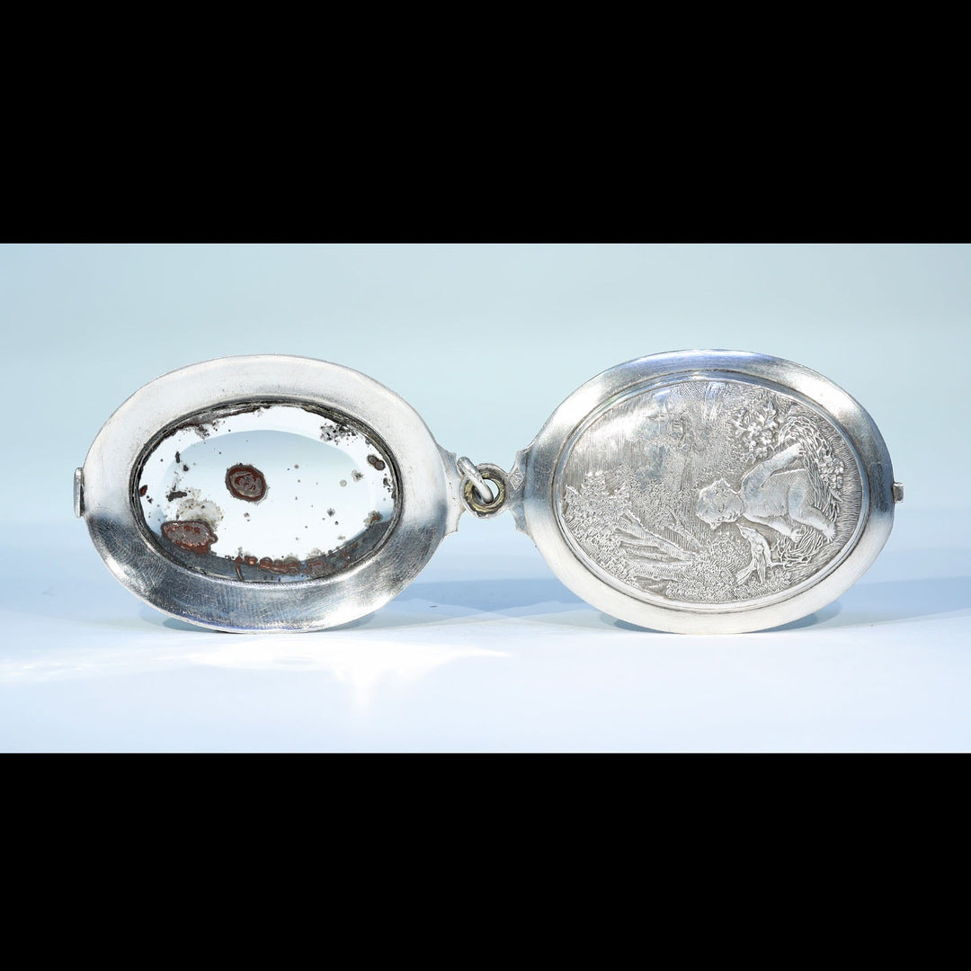 Antique French baby in nest pendant with sliding compartment