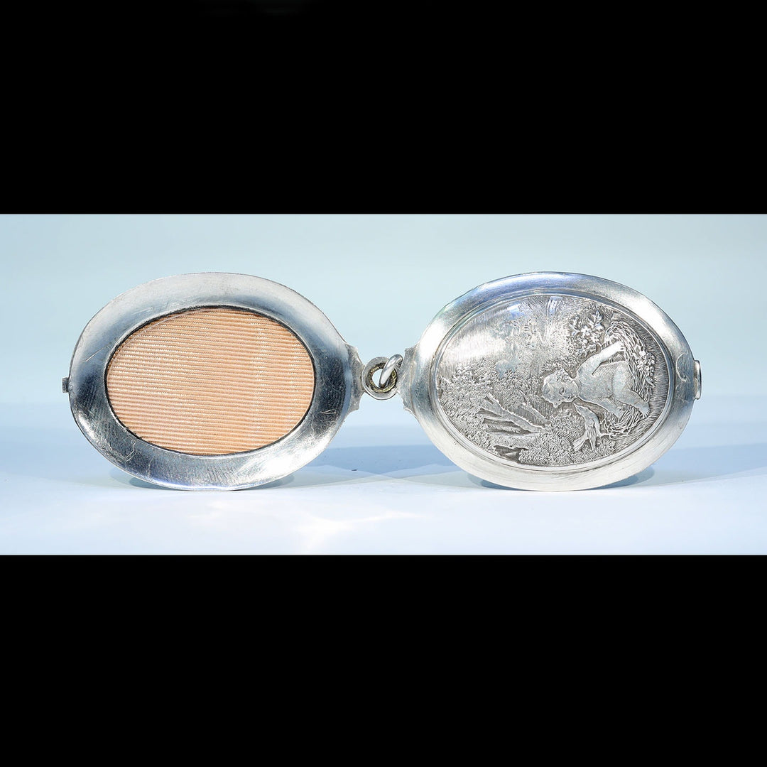Victorian era silver locket with childhood symbolism