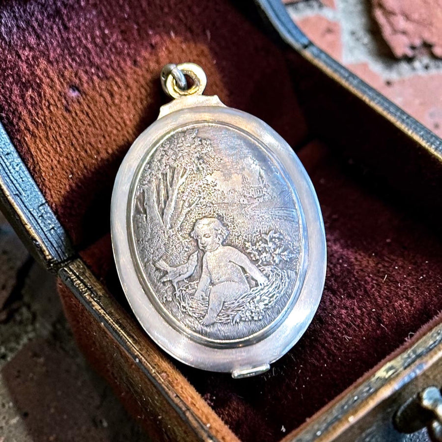 Antique French silver baby in nest slide locket circa 1880