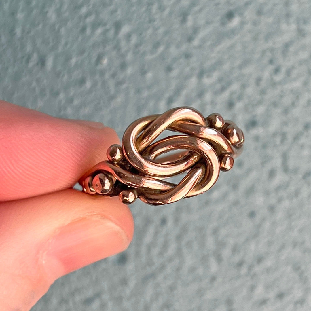 Victorian gold knot ring interwoven band design