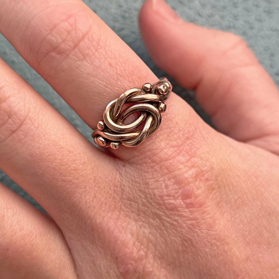 Victorian love knot ring worn on hand antique style