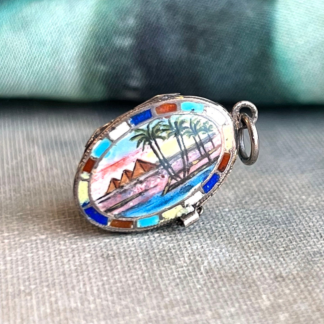 Close up hand painted enamel Egyptian landscape locket