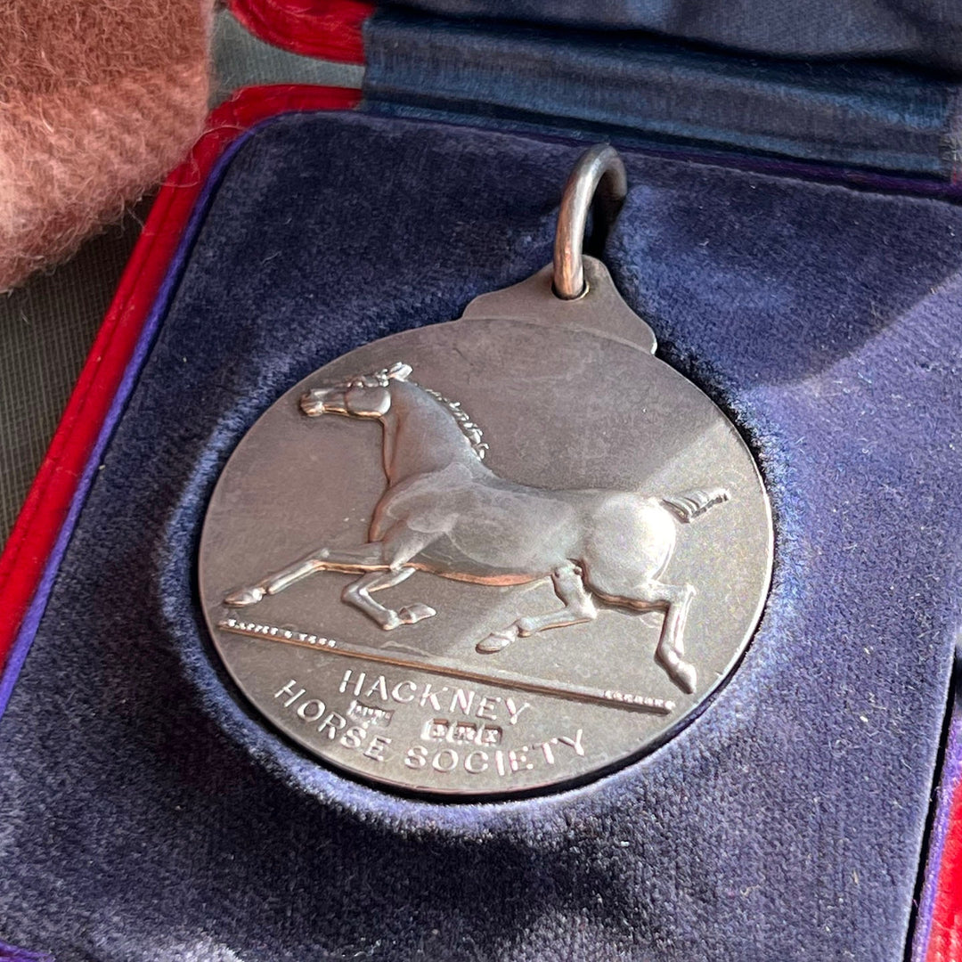 Close up antique equestrian medal horse design sterling silver