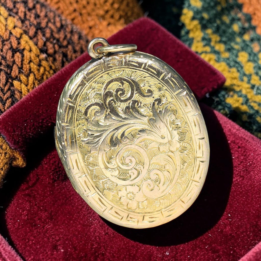 Antique Victorian 15 karat gold engraved oval locket circa 1880