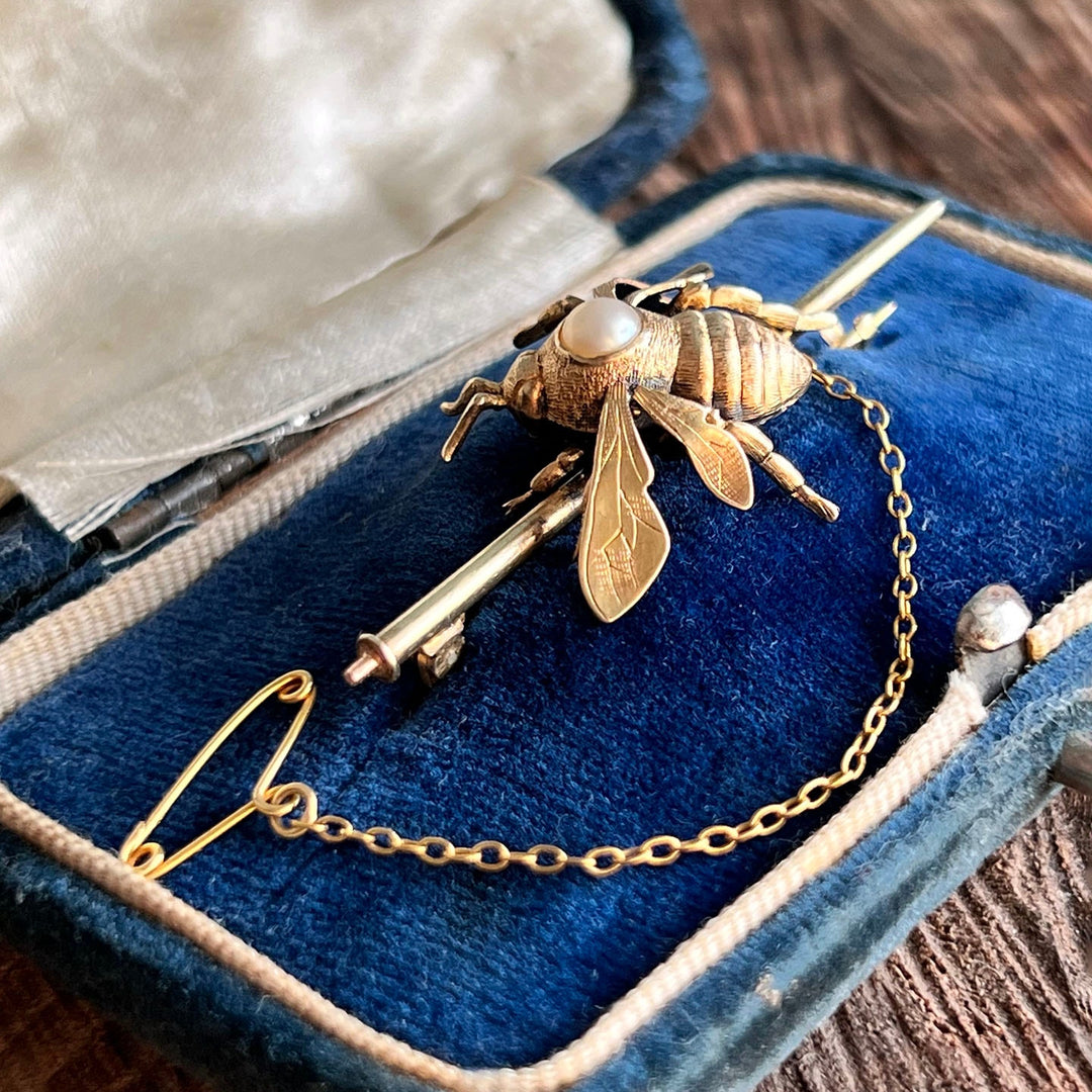 Close up of the gold craftsmanship and pearl details