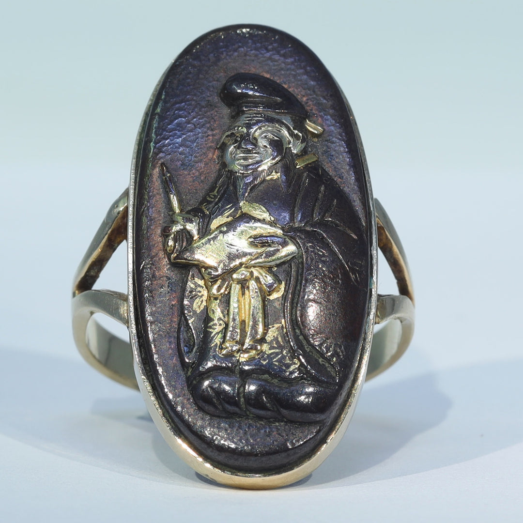 Antique Shakudo ring featuring god of prosperity