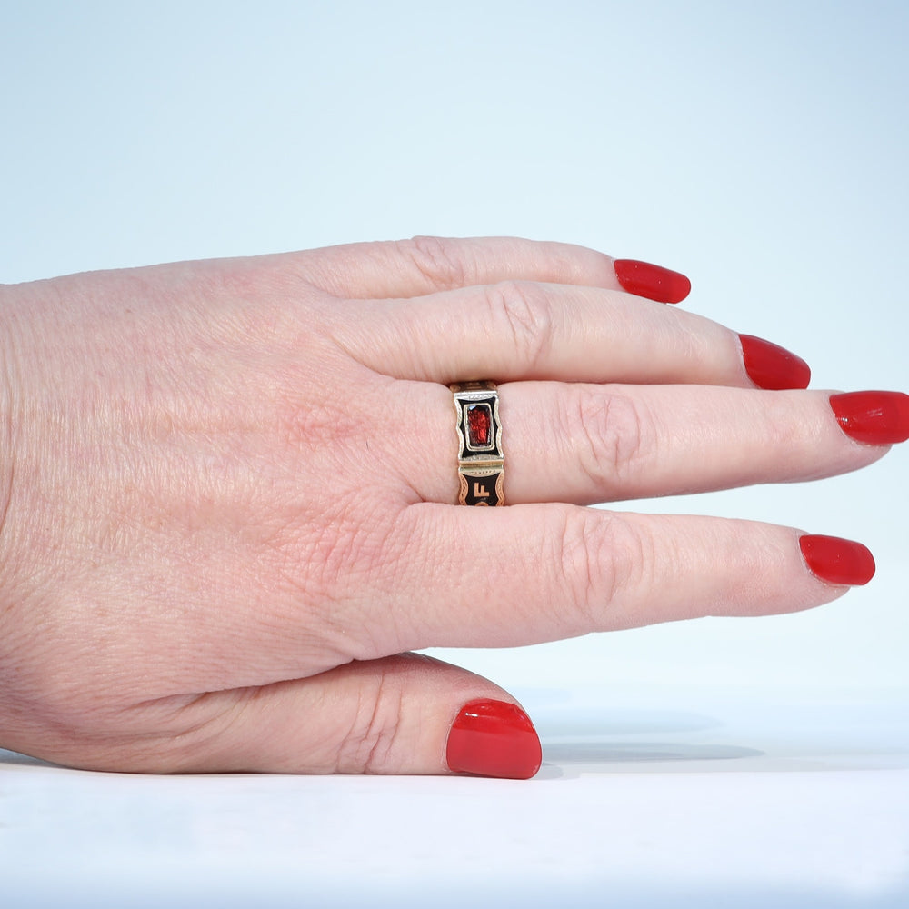 Victorian black enamel and garnet memorial ring dated 1869