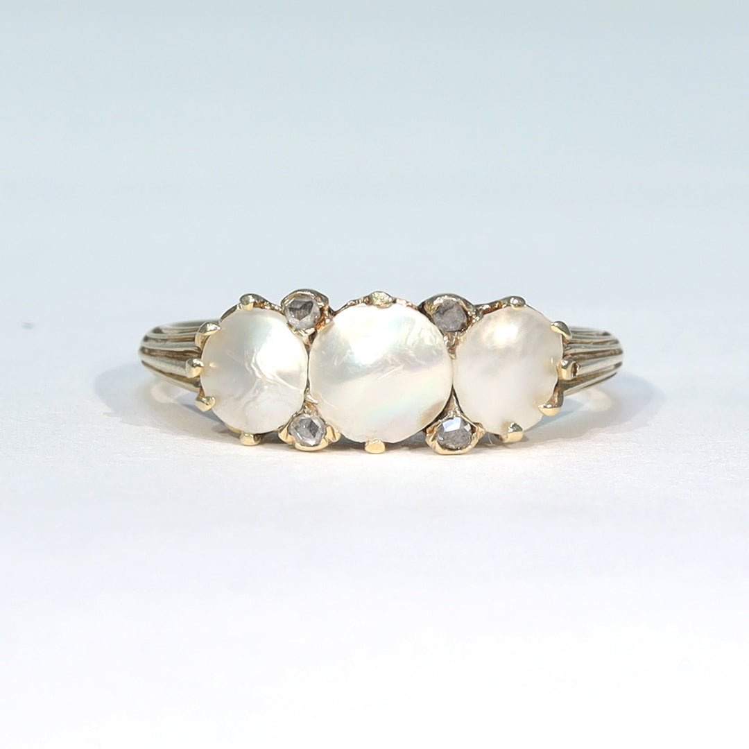 Victorian mother of pearl ring accented with rose cut diamonds