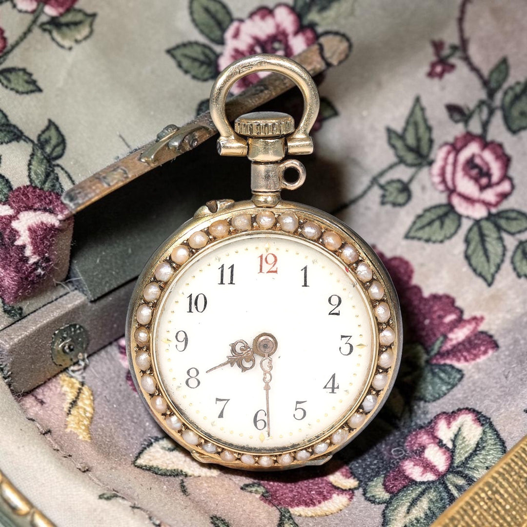 Victorian gold watch pendant set with rubies and pearls