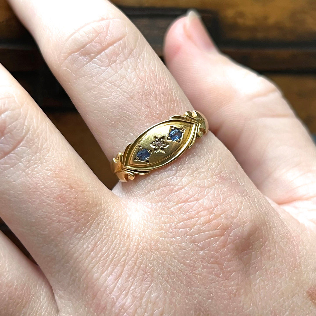 Victorian sapphire ring worn on hand antique style