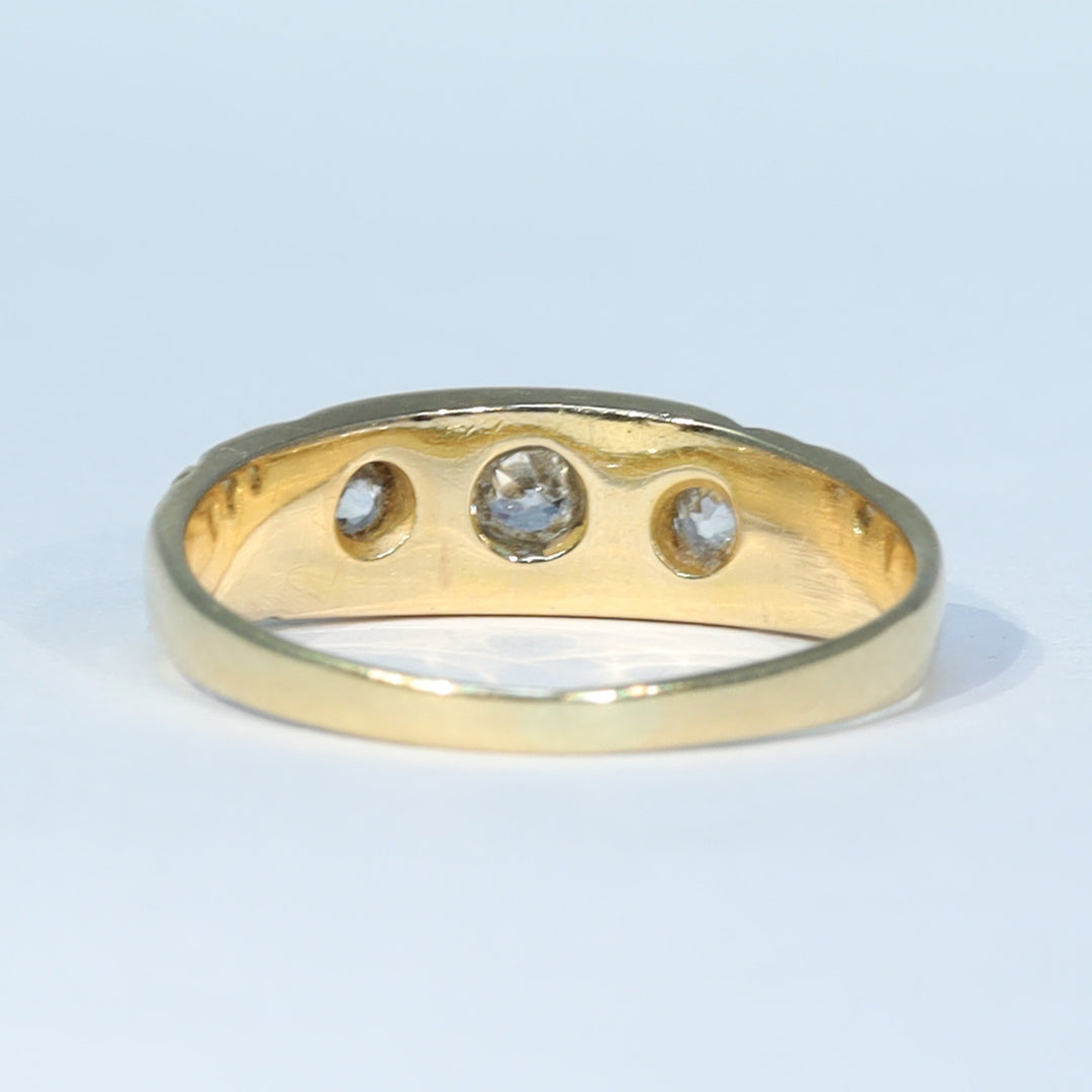 Antique three stone diamond ring in yellow gold