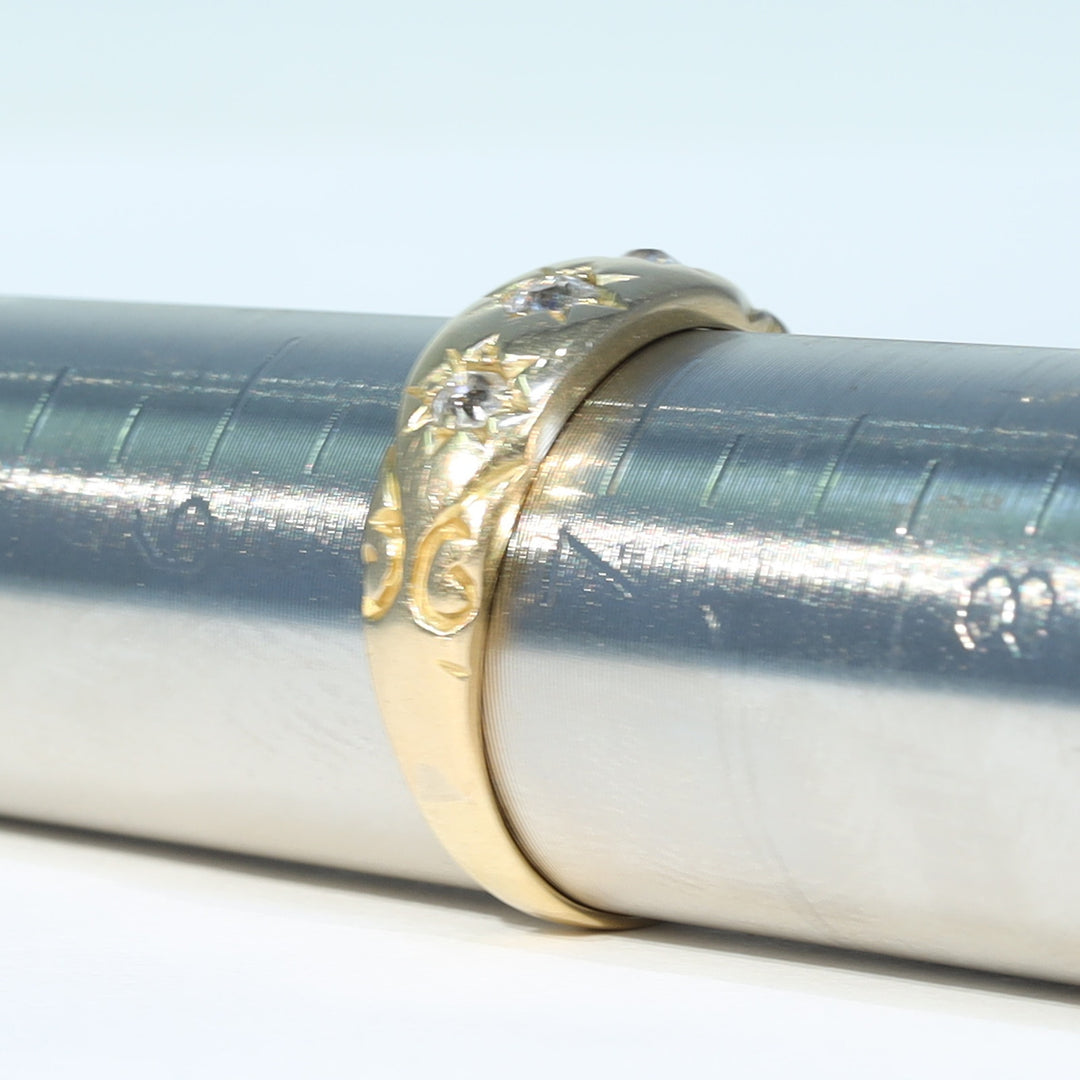 Antique three stone diamond ring in yellow gold